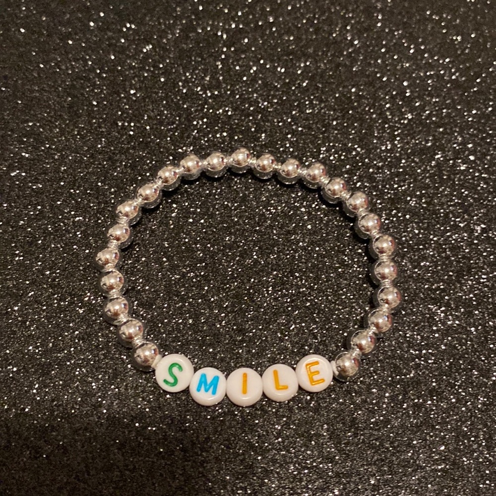 Girls faux silver bead smile stretch bracelet